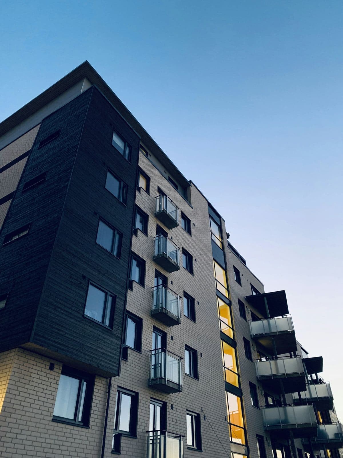 Modern apartment building at dusk
